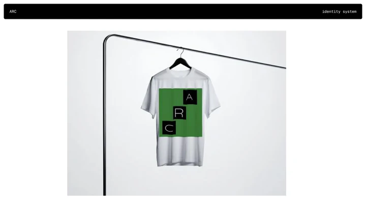 White T-shirt printed with the green and black modular ARC graphic